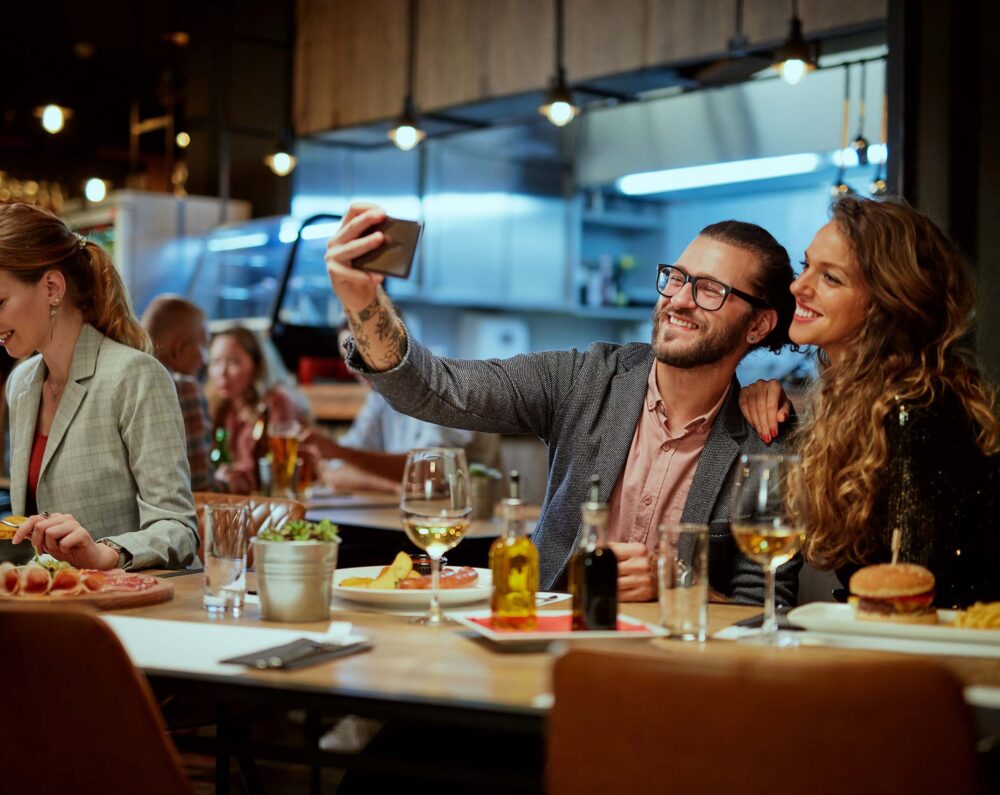 Couple taking selfie at a restaurant